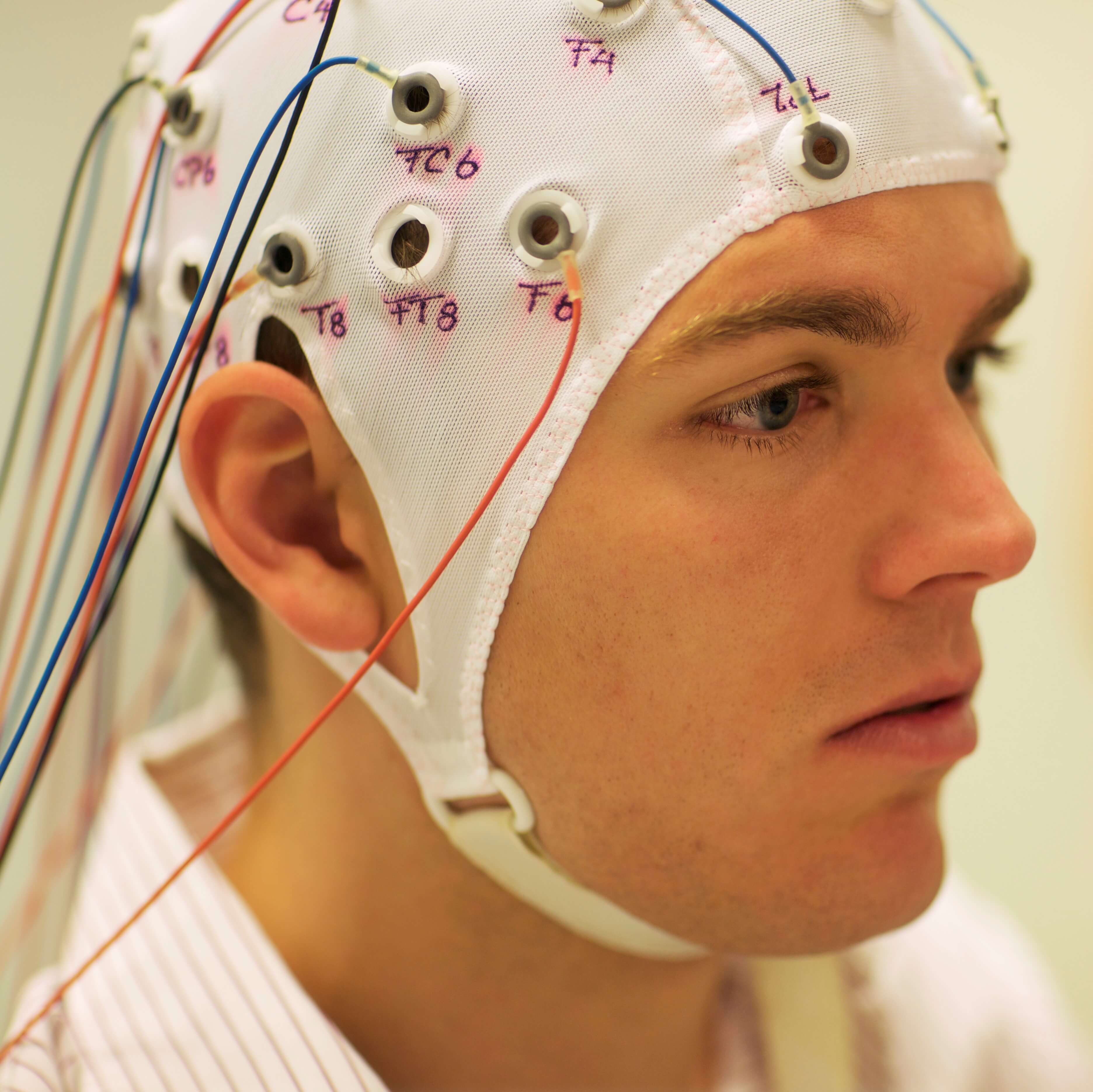 Man connected with cables to computer