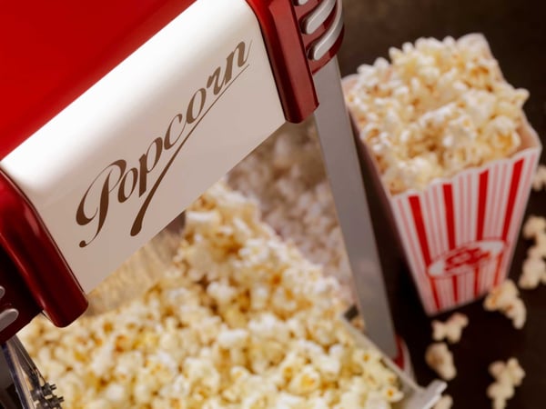 A popcorn machine filled with popcorn
