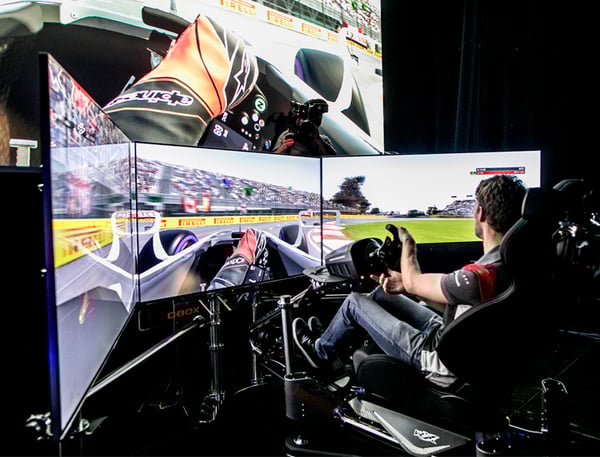 A man on a sim racing rig